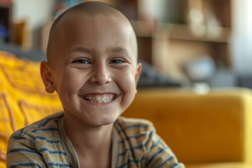 Kid girl sick with cancer smiles happily Filled with hope for cu Kid girl sick with cancer smiles happily Filled with hope for curing cancer with modern treatment technology. Use of high quality medicines and monitoring of treatment results from cancer treatment specialists.